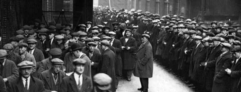 Labourers queue for work at the London docks in 1931. Photograph: Fox Photos/Getty Images