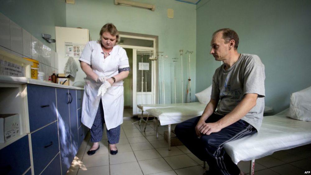 A patient waits to be treated in the toxicology unit in a hospital treating drug users in separatist-held Donetsk.