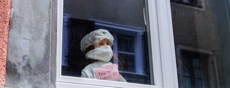 Girl with mask on window